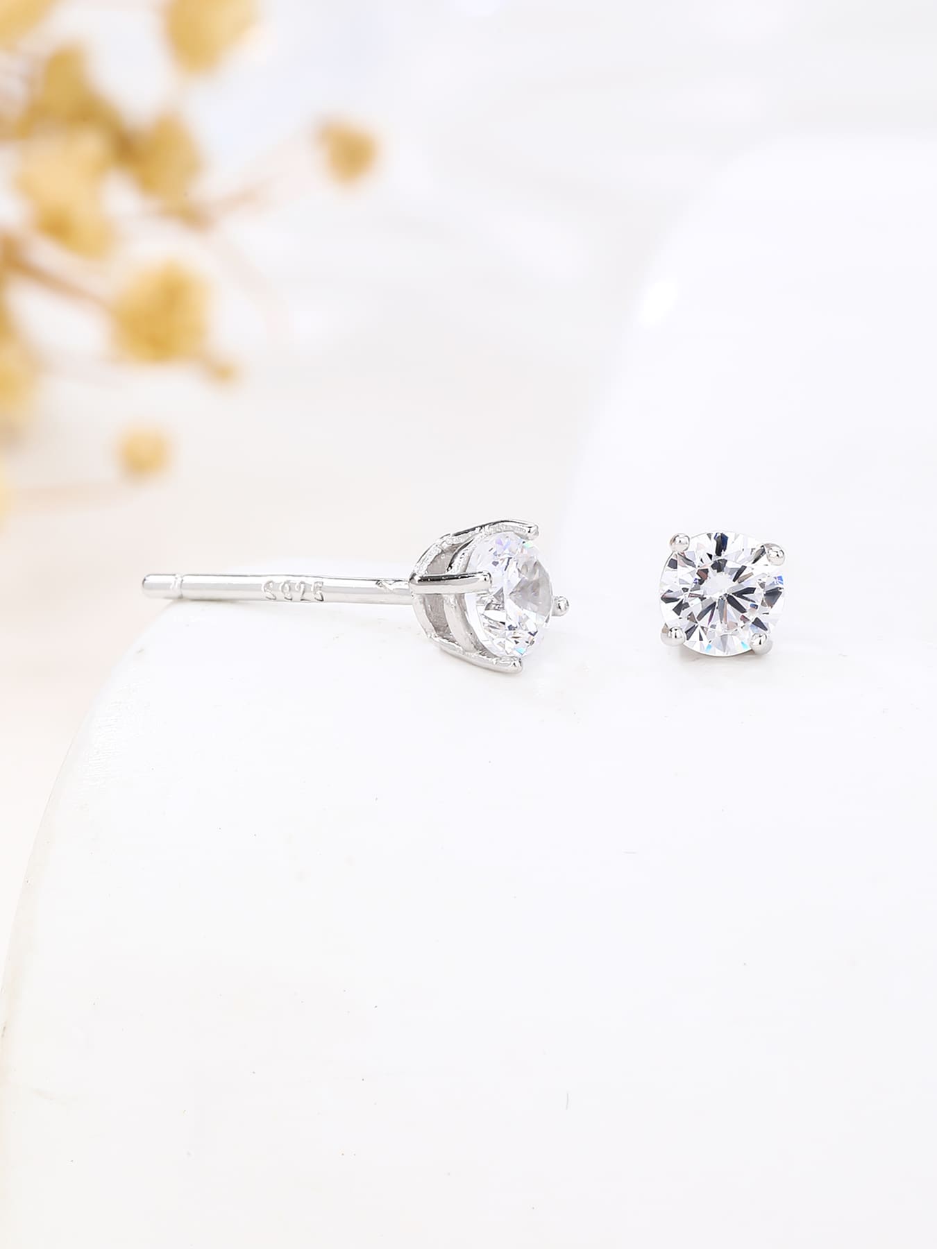 White cubic zirconia hallmarked, rhodium-plated 925 sterling silver stud earrings – side view – DRESCHER Jewellery®