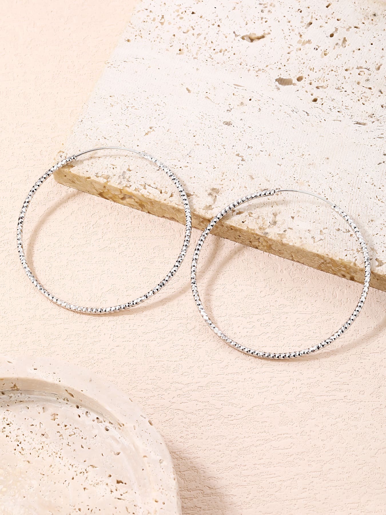 5.5 cm diamond-engraved hoop earrings in hallmarked, rhodium-plated 925 sterling silver – lifestyle view – DRESCHER Jewellery®