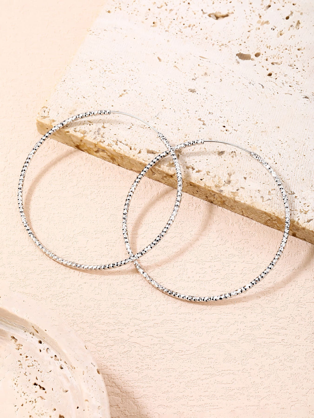 6 cm diamond-engraved hoop earrings in hallmarked, rhodium-plated 925 sterling silver – lifestyle view – DRESCHER Jewellery®