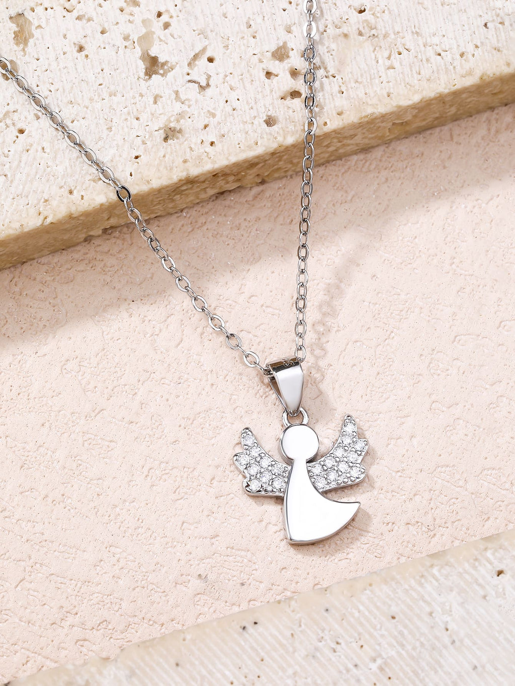 Cubic zirconia hallmarked, rhodium-plated 925 sterling silver angel pendant – lifestyle view – DRESCHER Jewellery®