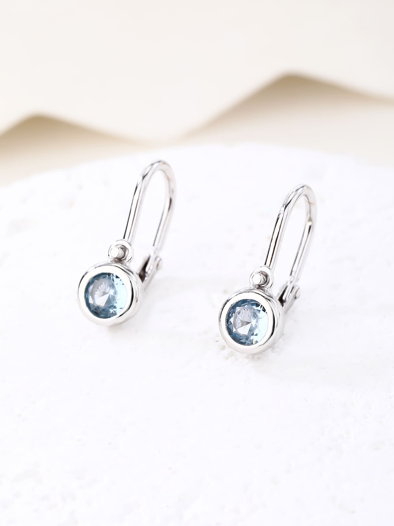 aqua blue stone baby earrings with front clasp in hallmarked, rhodium-plated 925 sterling silver – display view – DRESCHER Jewellery®