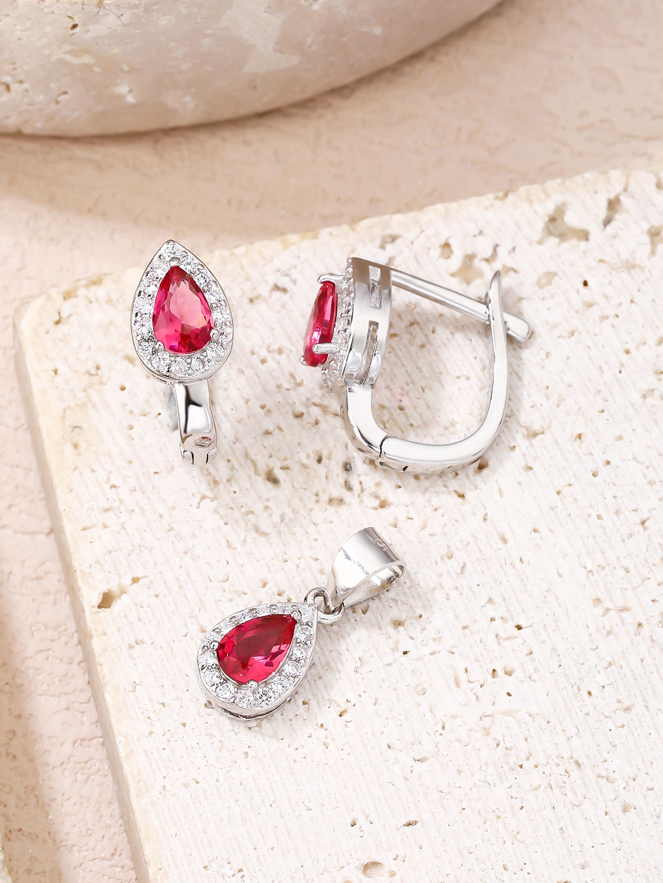 Drop shaped fuchsia red stone with white cubic zirconia stones (without chain) in hallmarked, rhodium-plated 925 sterling silver – display view – DRESCHER Jewellery®