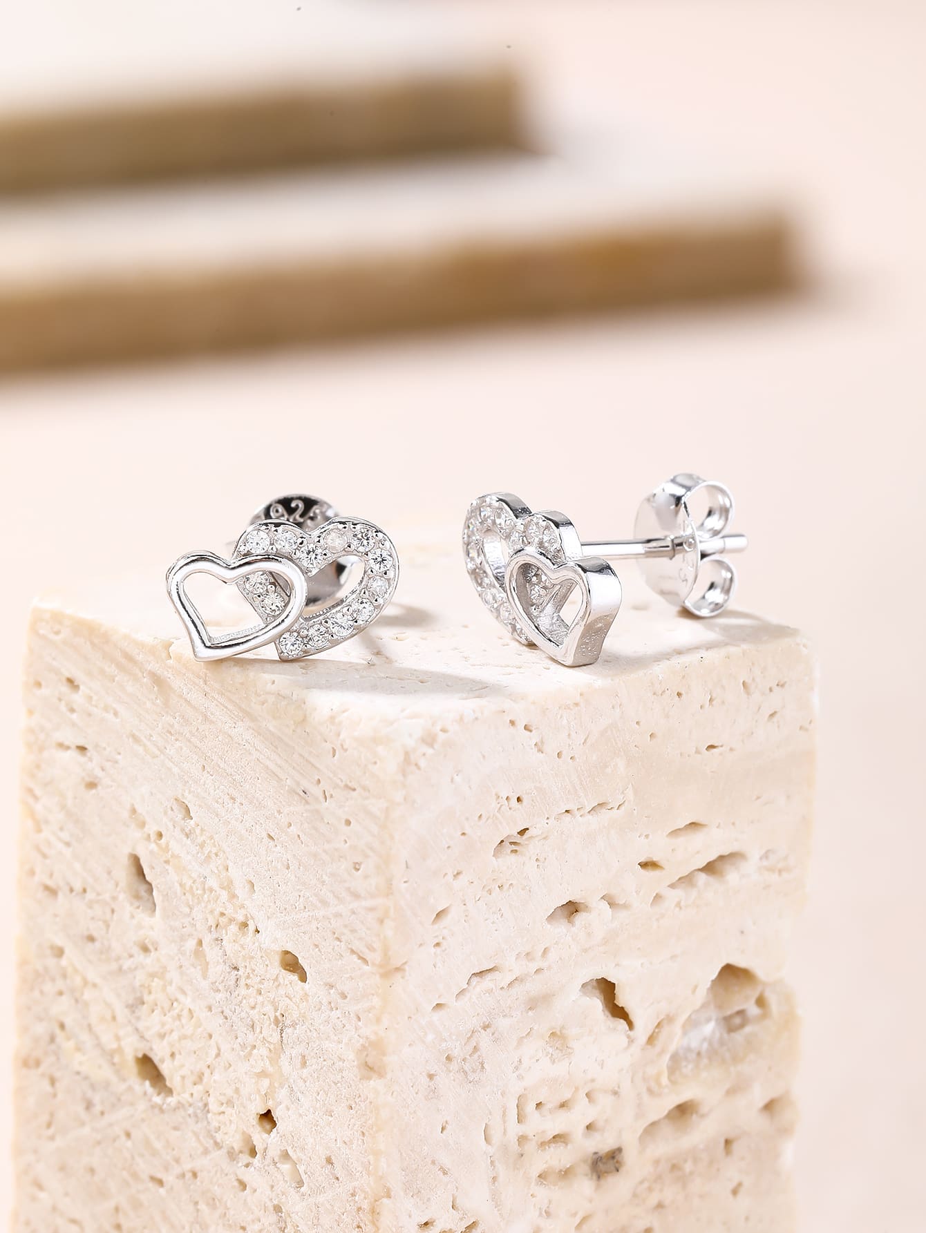 white cubic zirconia double-heart stud earrings in hallmarked, rhodium-plated 925 sterling silver – lifestyle view – DRESCHER Jewellery®