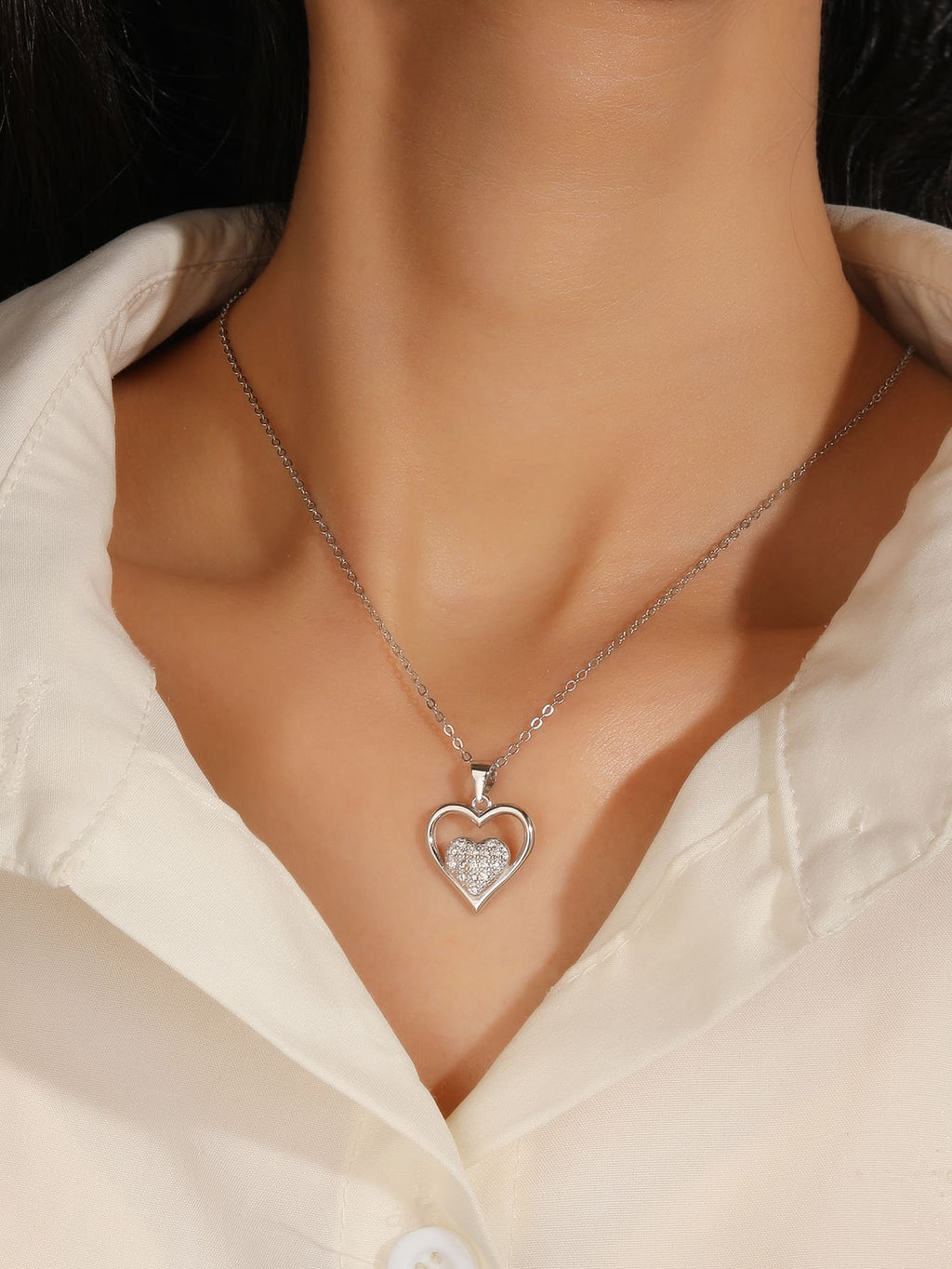 Double heart pendant with zirconia in hallmarked, rhodium-plated 925 sterling silver – worn view – DRESCHER Jewellery®