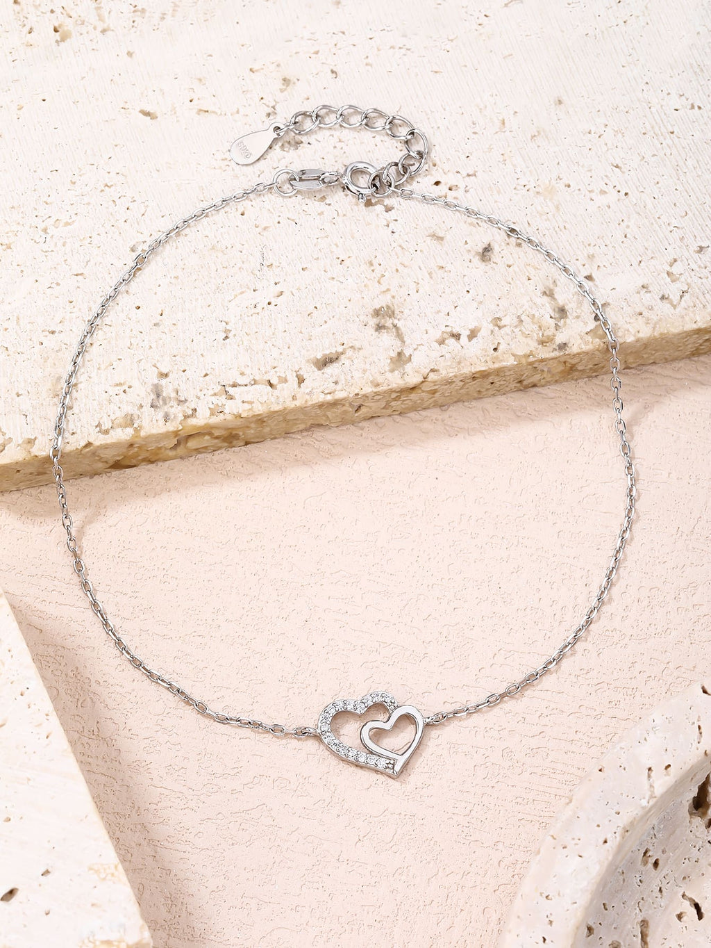 anklet with double heart motif and cubic zirconia stones(23+4 cm) in hallmarked, rhodium-plated 925 sterling silver – alternate front view – DRESCHER Jewellery®