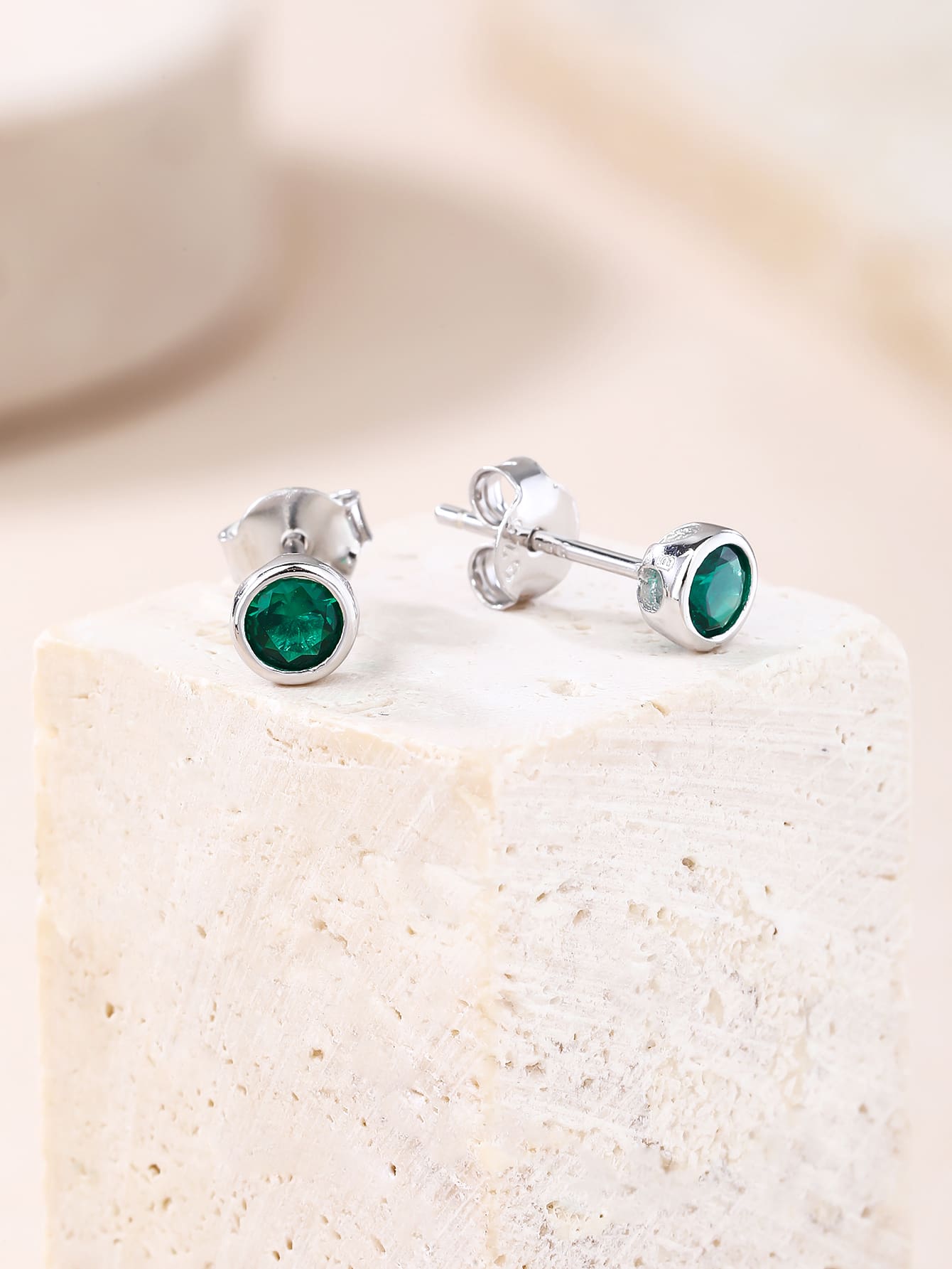 Green cubic zirconia button-set stud earrings in hallmarked, rhodium-plated 925 sterling silver – display view – DRESCHER Jewellery®