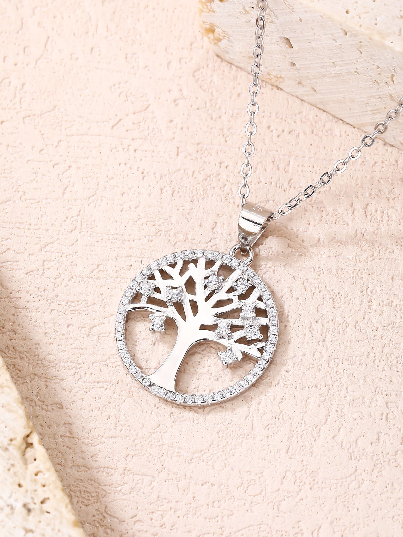 zirconia stone tree of life pendant - without chain in hallmarked, rhodium-plated 925 sterling silver – lifestyle view – DRESCHER Jewellery®