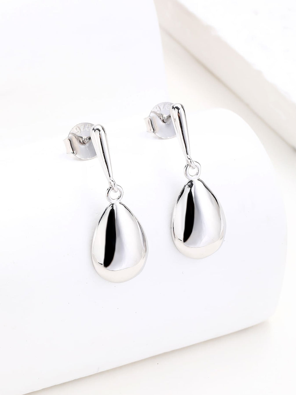 Polished teardrop dangle stud earrings in hallmarked, rhodium-plated 925 sterling silver – display view – DRESCHER Jewellery®