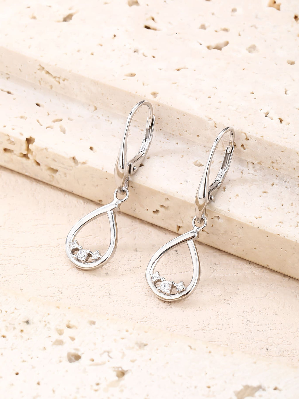 Teardrop white cubic zirconia leverback earrings in hallmarked, rhodium-plated 925 sterling silver – lifestyle view – DRESCHER Jewellery®