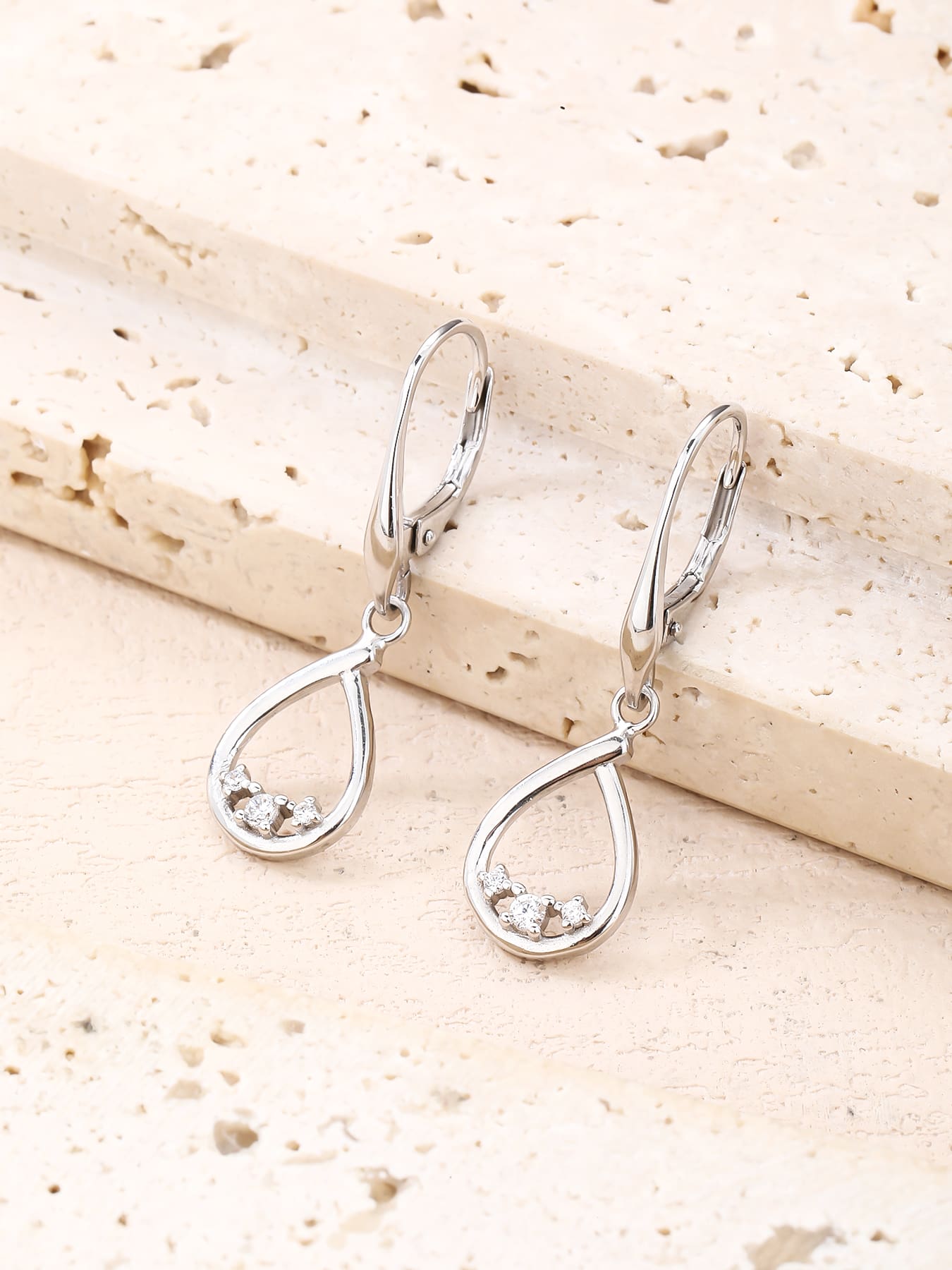 Teardrop white cubic zirconia leverback earrings in hallmarked, rhodium-plated 925 sterling silver – lifestyle view – DRESCHER Jewellery®