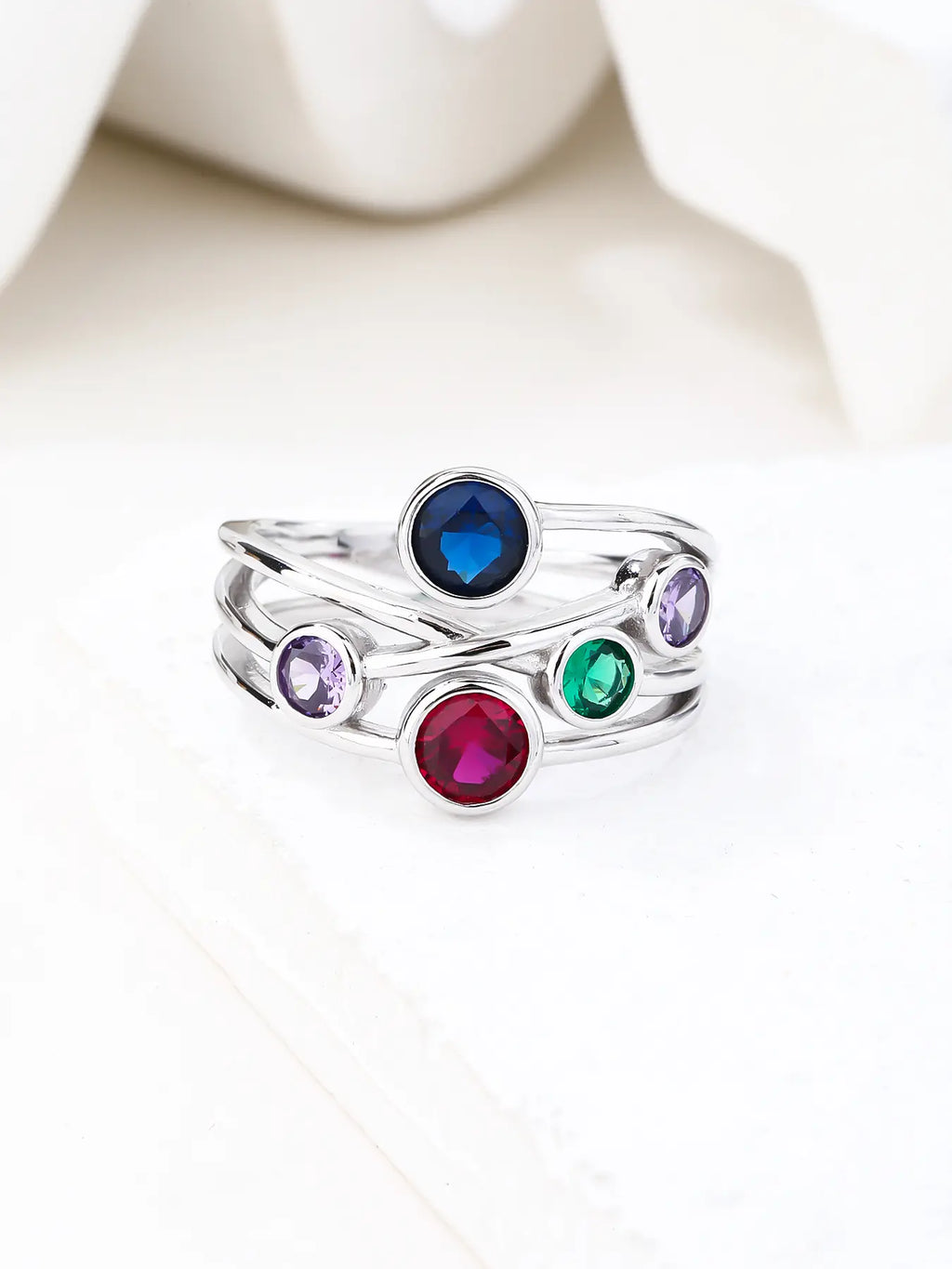 Silver design ring with coloured cubic zirconia stones