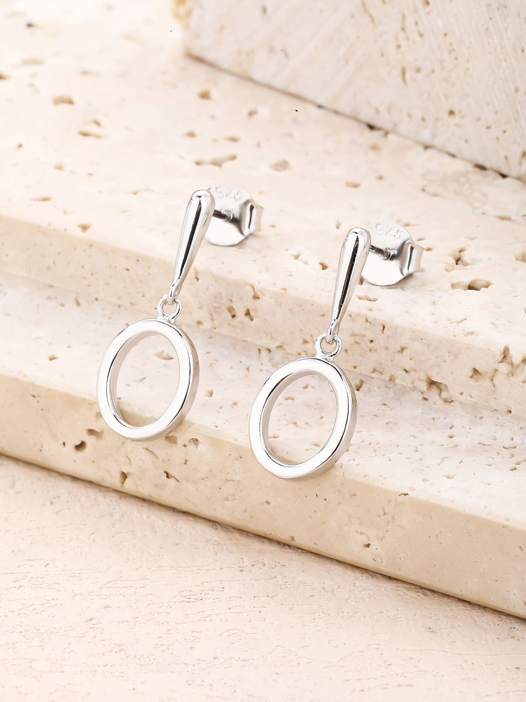 Open circle drop stud earrings in hallmarked, rhodium-plated 925 sterling silver – display view – DRESCHER Jewellery®