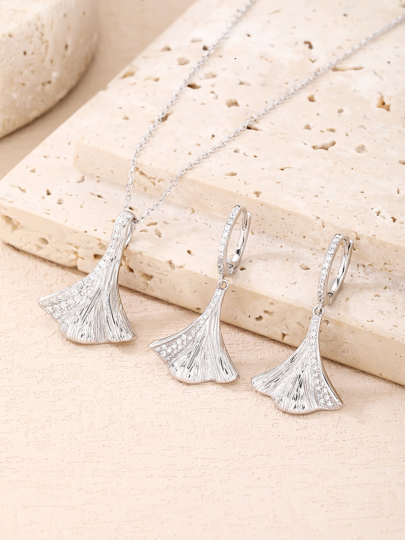 jewelled ginkgo biloba leaf shape with zirconia decoration in hallmarked, rhodium-plated 925 sterling silver – worn view – DRESCHER Jewellery®