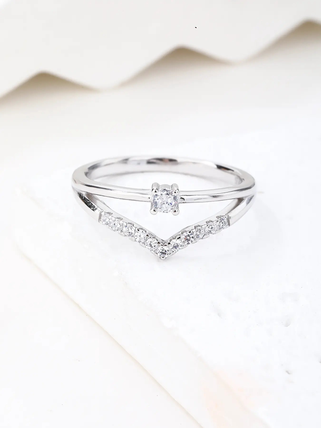 Silver engagement ring with white cubic zirconia stones