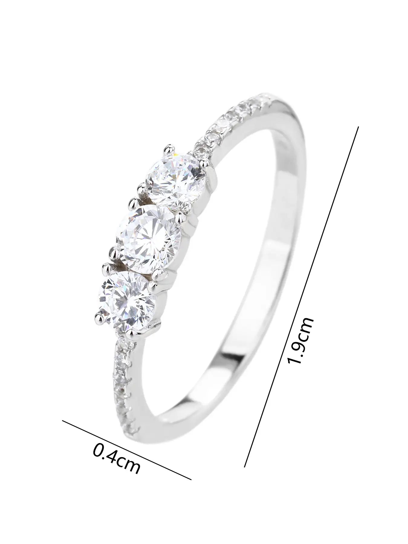 Silver engagement ring with three central and small cubic zirconia stones