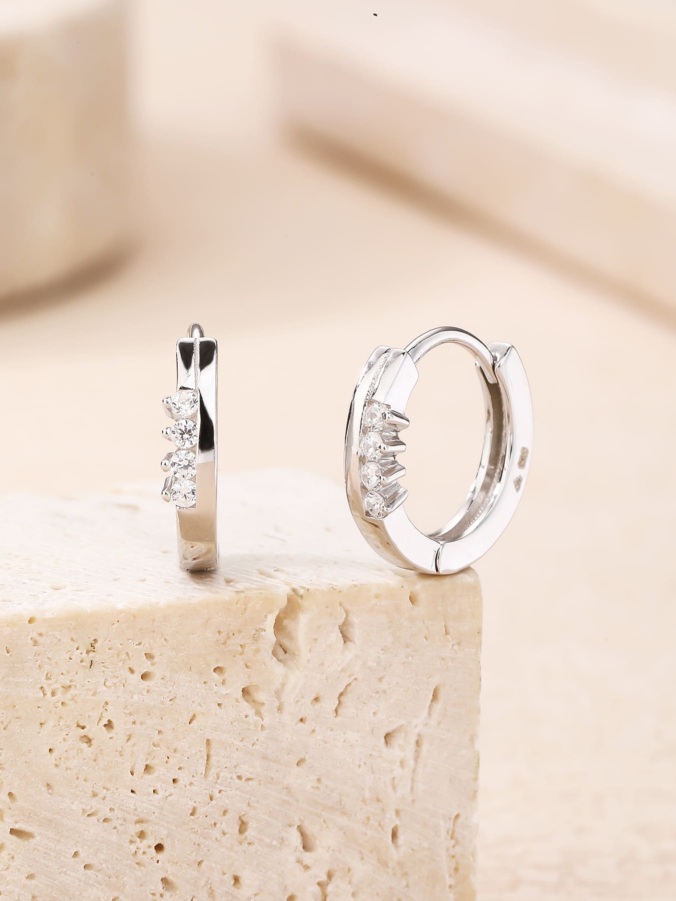 white cubic zirconia stone hoop earrings in hallmarked, rhodium-plated 925 sterling silver – display view – DRESCHER Jewellery®