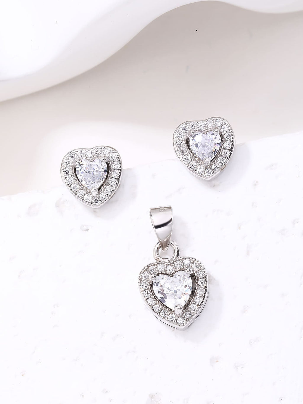 white heart shaped zirconia stud earrings and pendant set in hallmarked, rhodium-plated 925 sterling silver – lifestyle view – DRESCHER Jewellery®