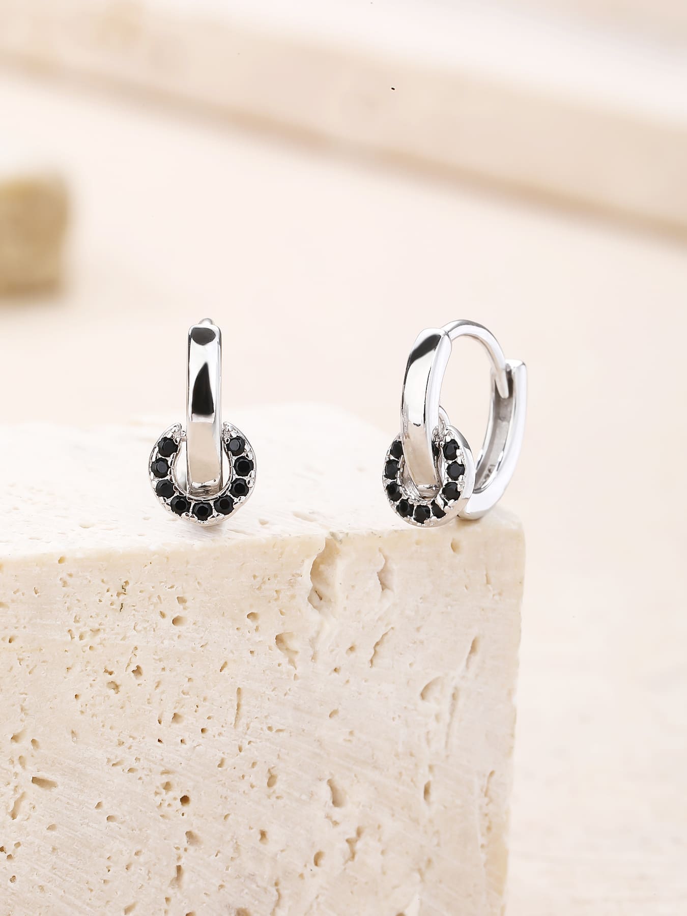 Black stone circle-detail hoop earrings in hallmarked, rhodium-plated 925 sterling silver – display view – DRESCHER Jewellery®