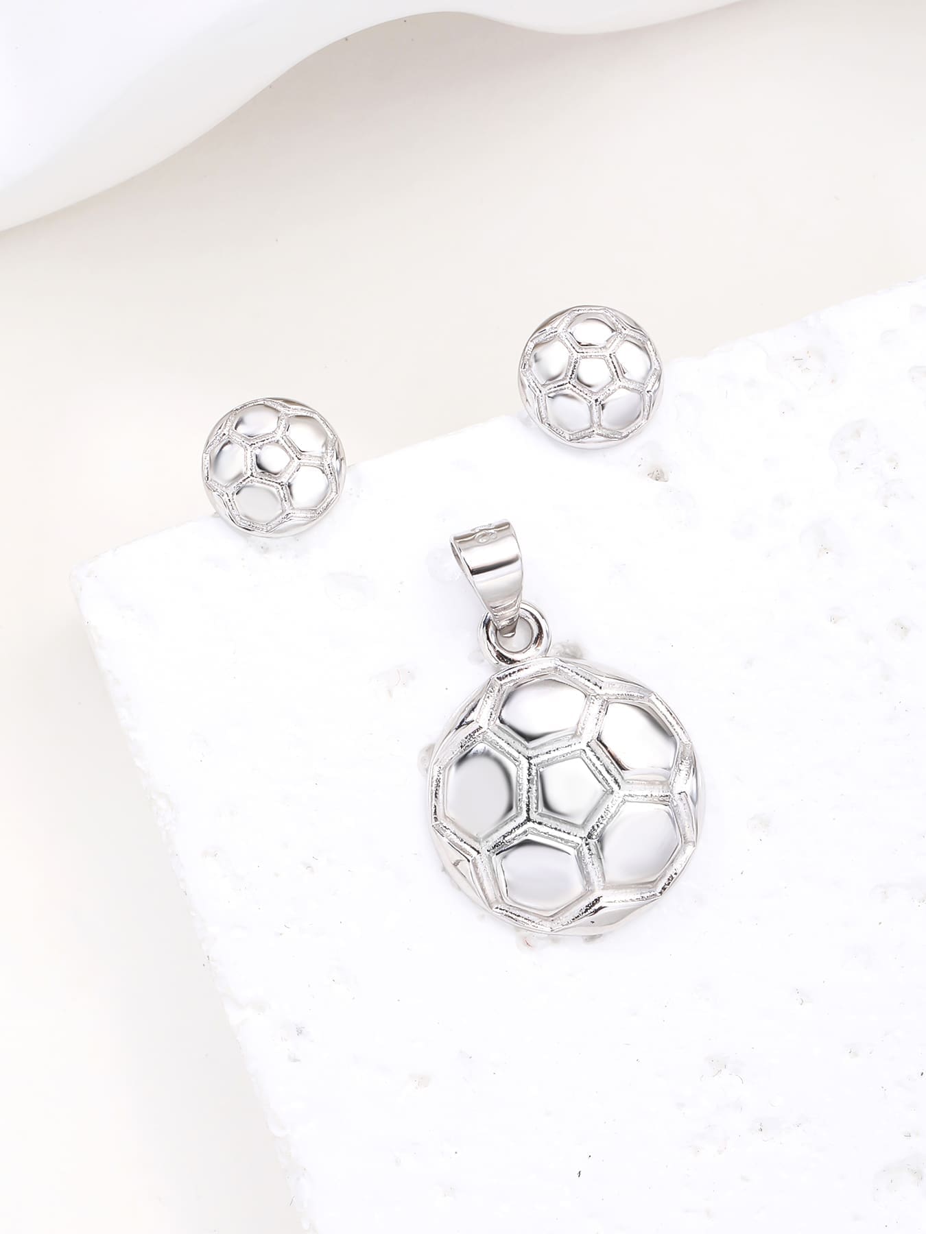 football wedge set in hallmarked, rhodium-plated 925 sterling silver – display view – DRESCHER Jewellery®