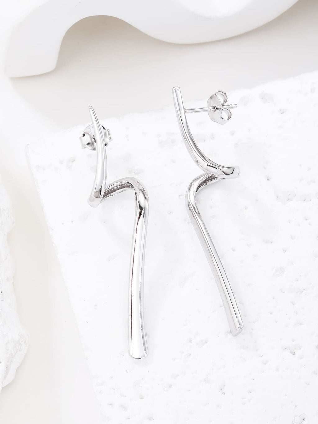 Abstract wave-form drop stud earrings in hallmarked, rhodium-plated 925 sterling silver – display view – DRESCHER Jewellery®