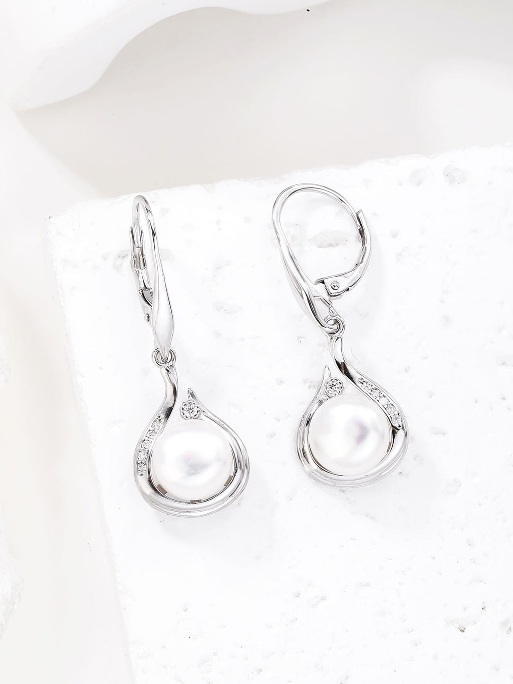 Pearl and white cubic zirconia teardrop leverback earrings, with silver components crafted from hallmarked, rhodium-plated 925 sterling silver – display view – DRESCHER Jewellery®