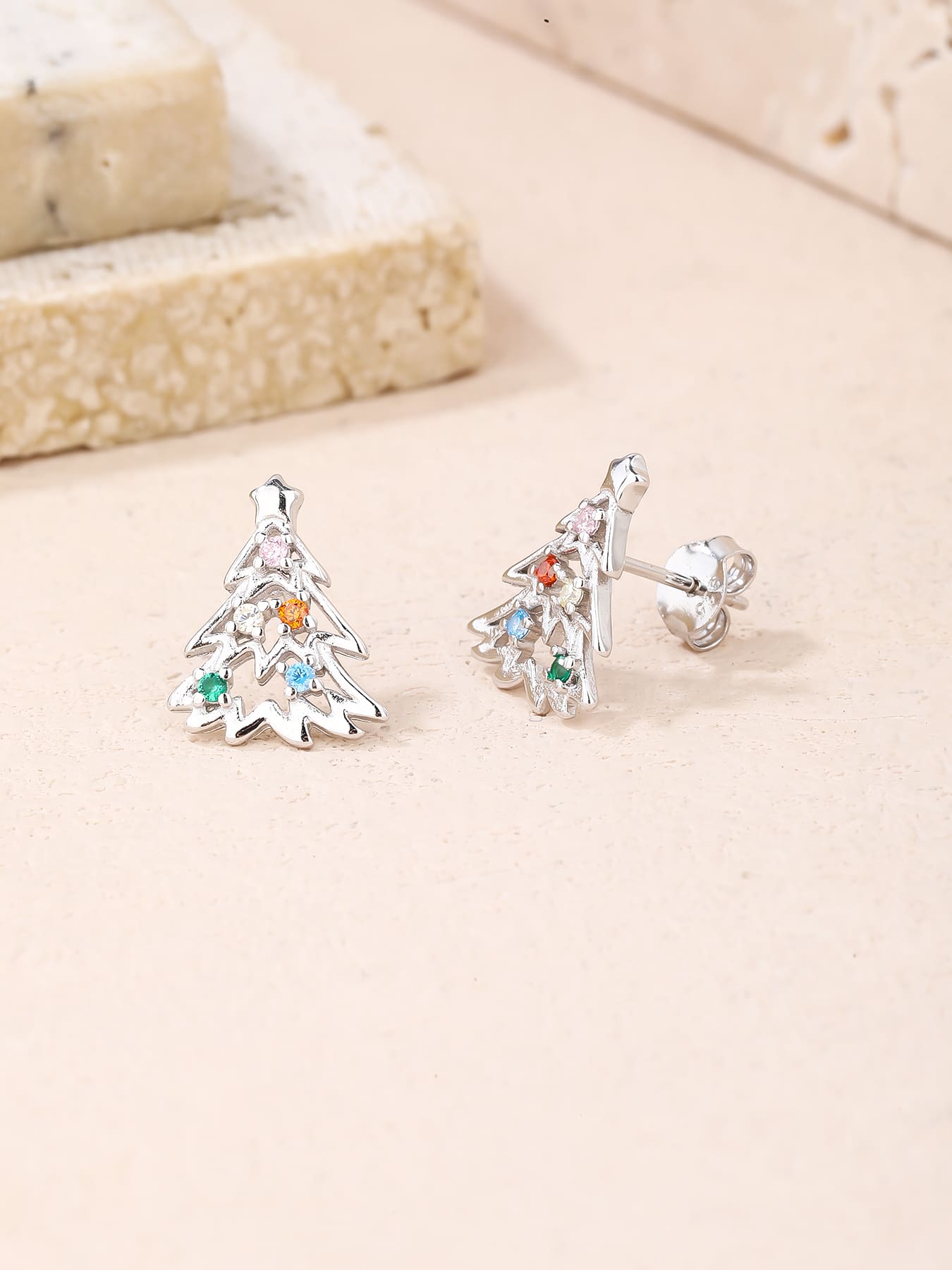 Multicoloured cubic zirconia Christmas-tree stud earrings in hallmarked, rhodium-plated 925 sterling silver – lifestyle view – DRESCHER Jewellery®