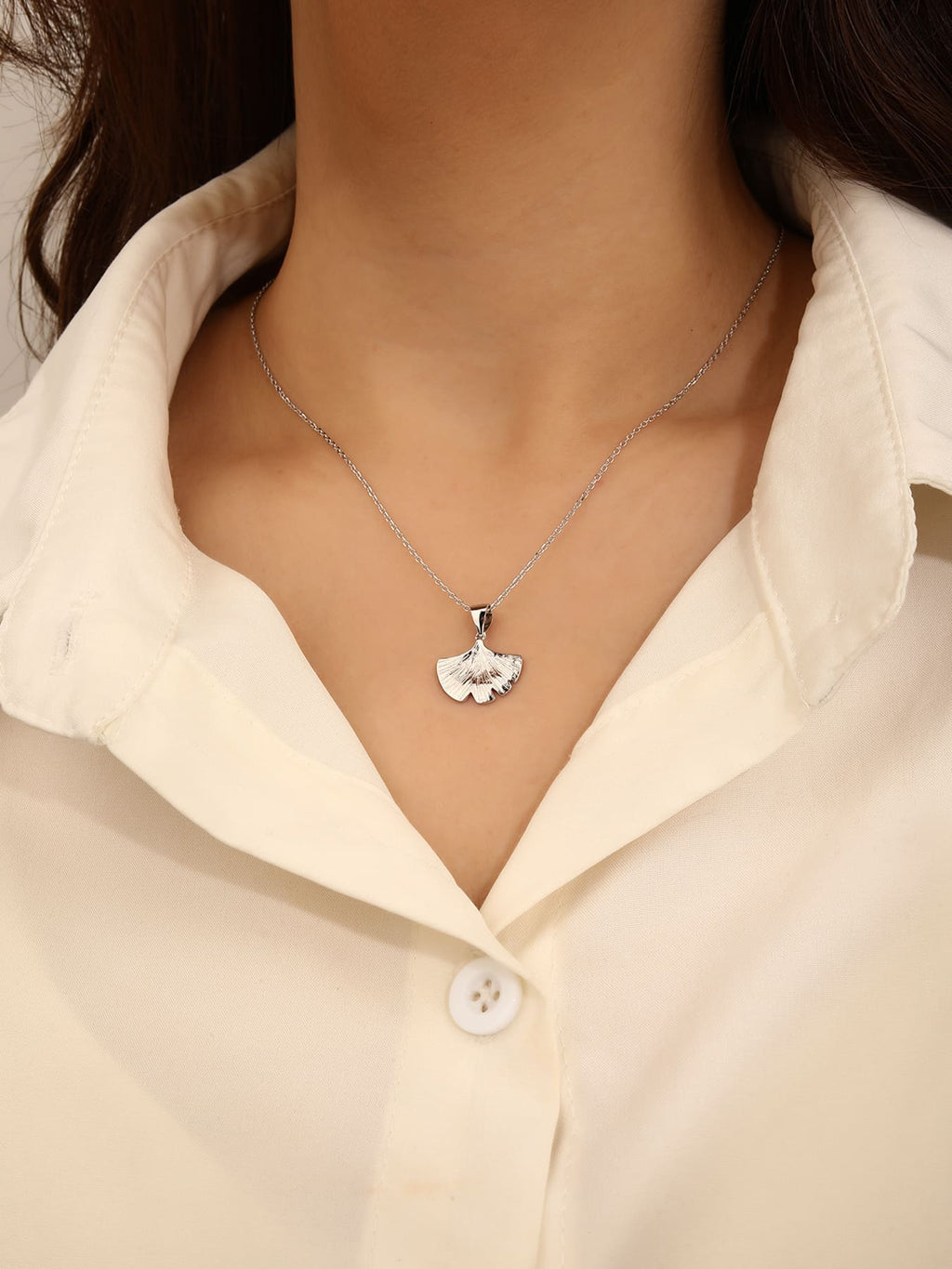 ginkgo biloba leaf necklace in hallmarked, rhodium-plated 925 sterling silver – worn view – DRESCHER Jewellery®