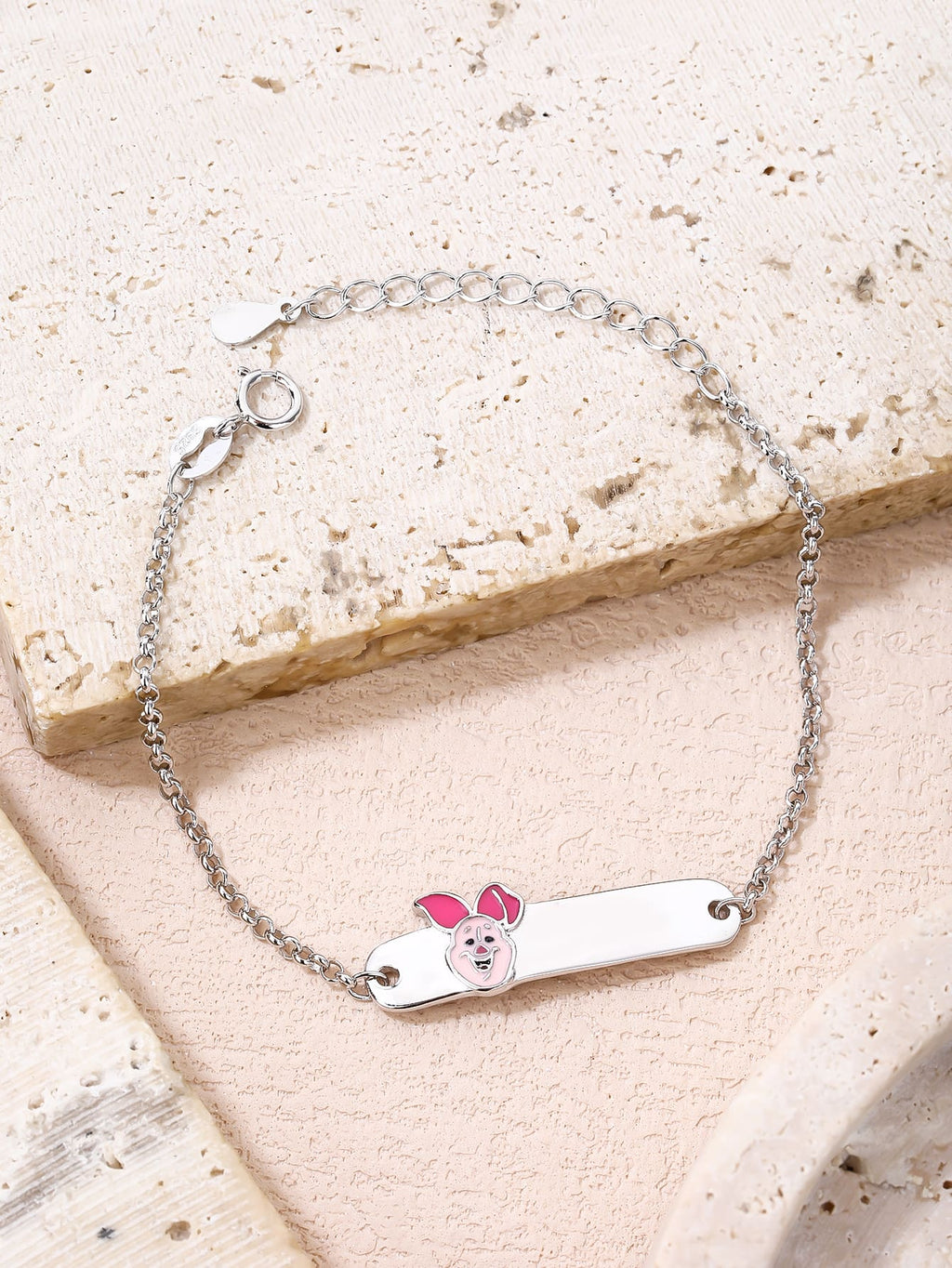Pink enamel pig hallmarked, rhodium-plated 925 sterling silver children’s ID bracelet – lifestyle view – DRESCHER Jewellery®