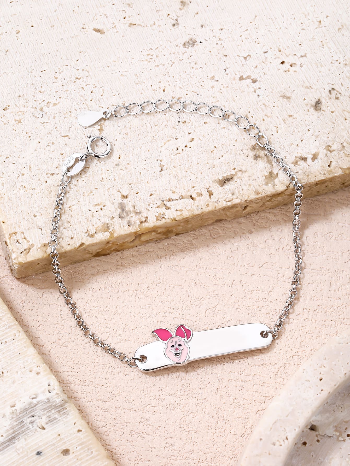 Pink enamel pig hallmarked, rhodium-plated 925 sterling silver children’s ID bracelet – lifestyle view – DRESCHER Jewellery®
