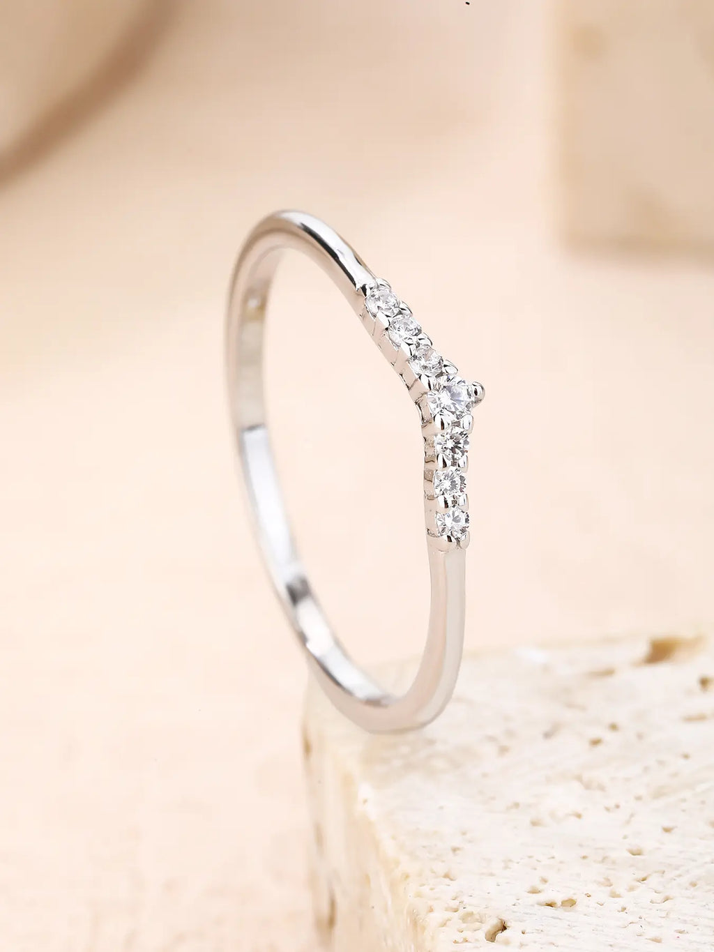 Silver ring with white cubic zirconia stones and V-shaped decoration