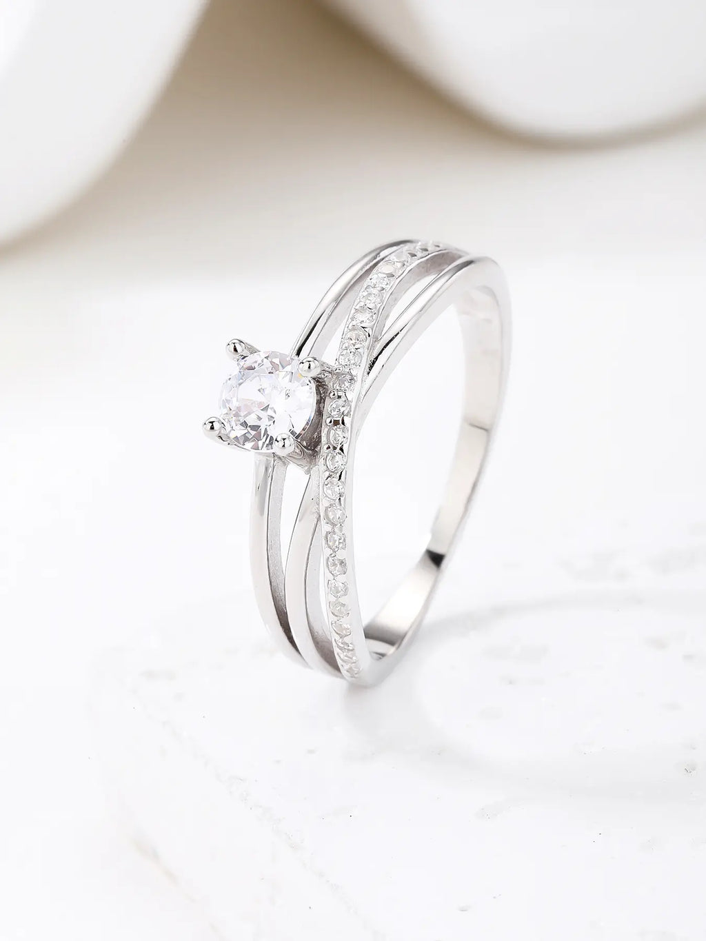Silver engagement ring with white cubic zirconia stones