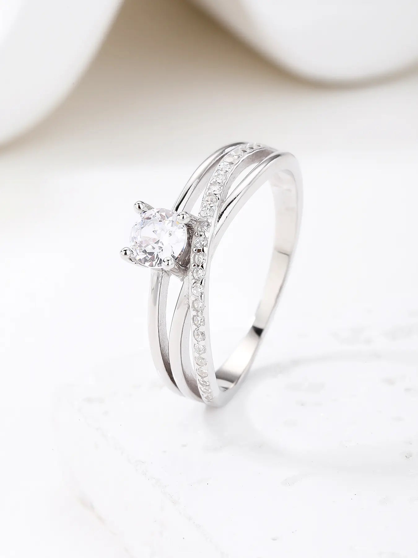 Silver engagement ring with white cubic zirconia stones