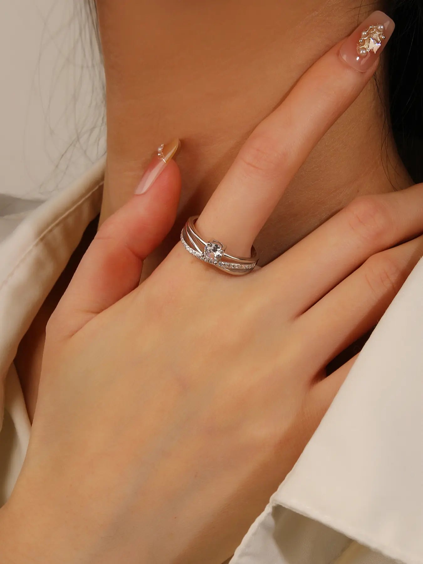 Silver engagement ring with white cubic zirconia stones
