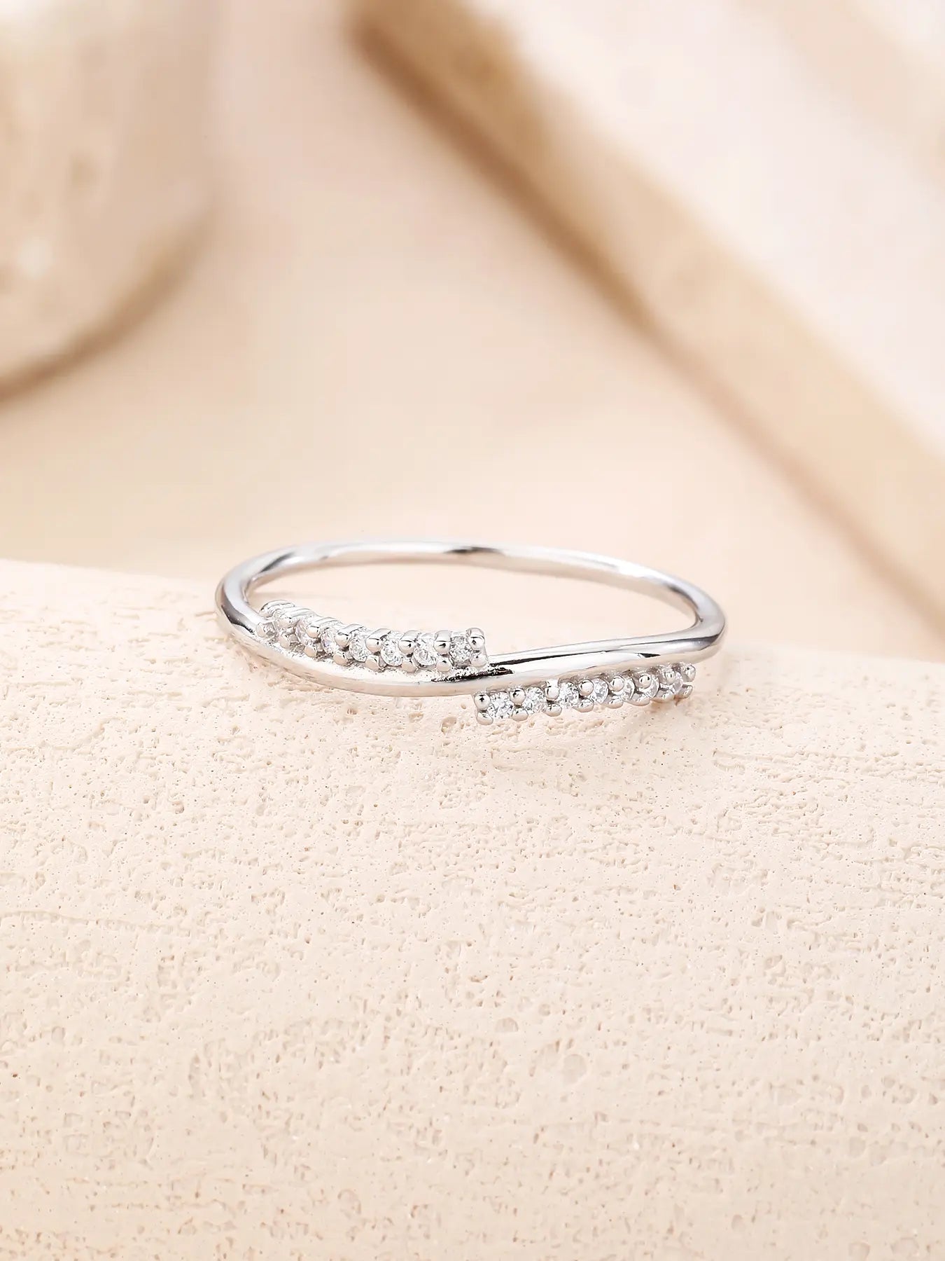 Silver ring with curved lines and zirconia decoration