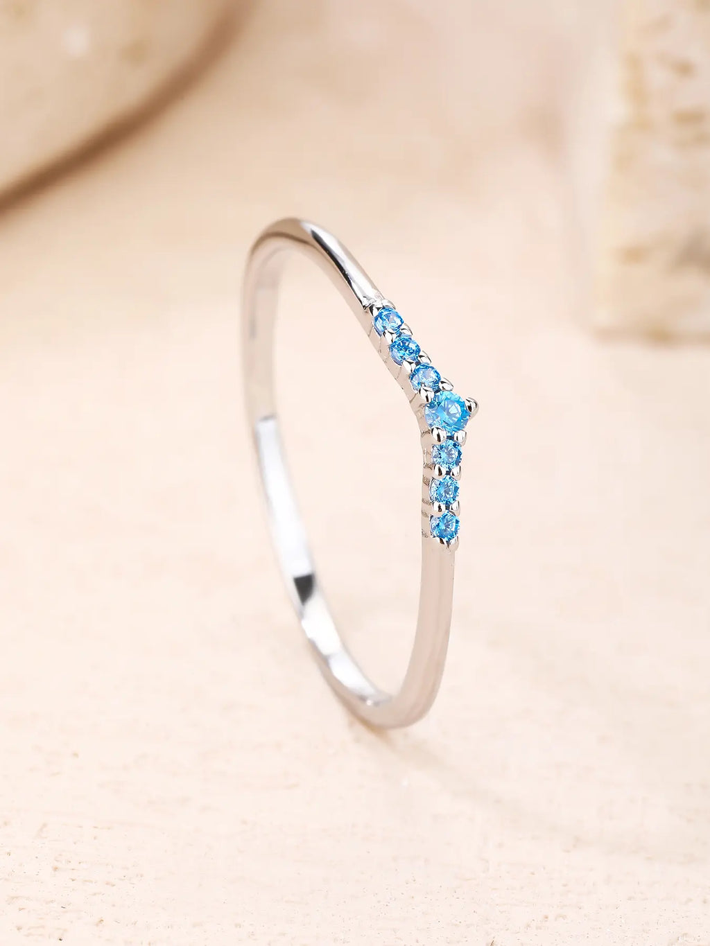 Silver ring with blue cubic zirconia stones, V-shaped decoration