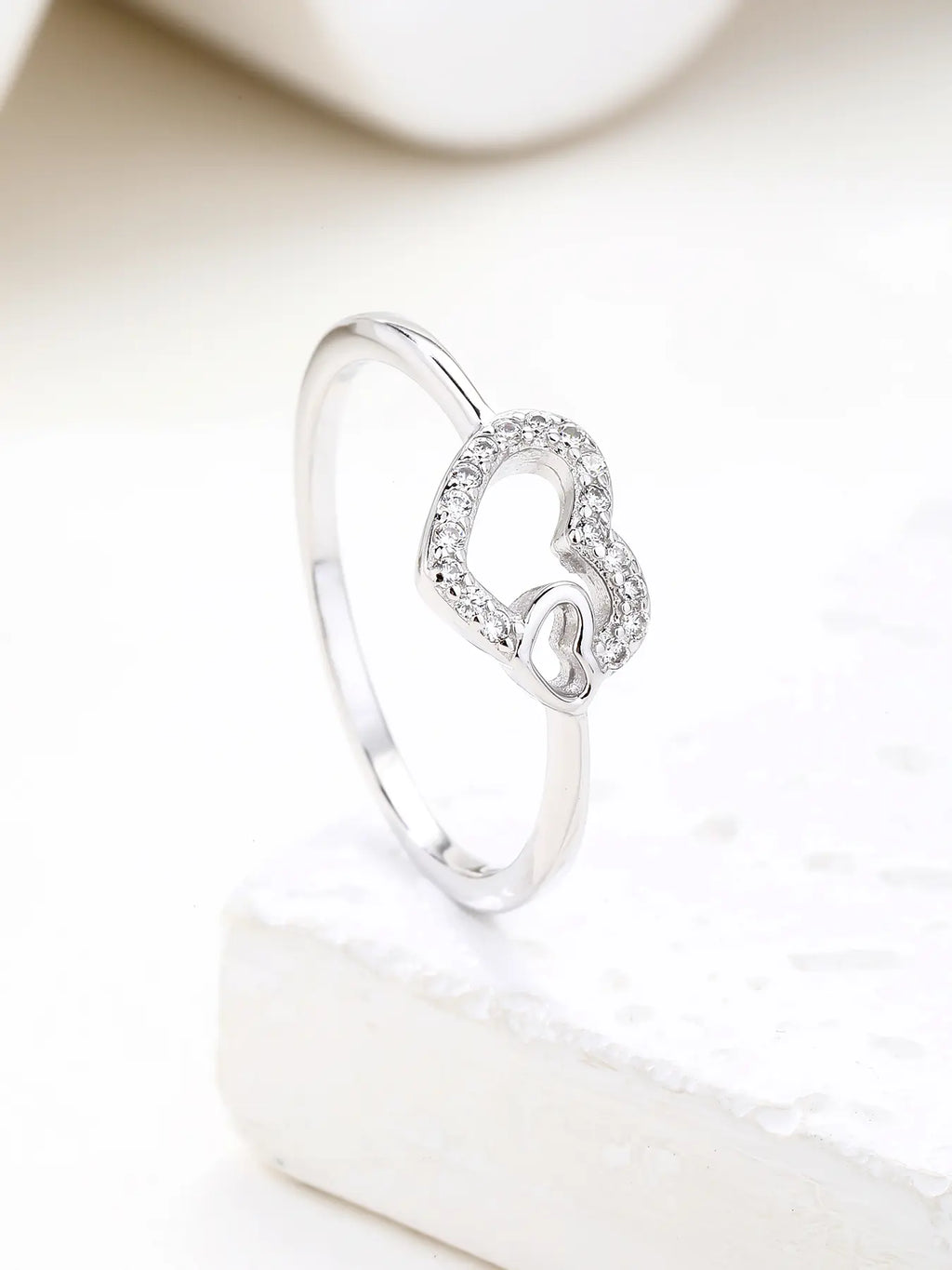 Silver ring with two hearts motif