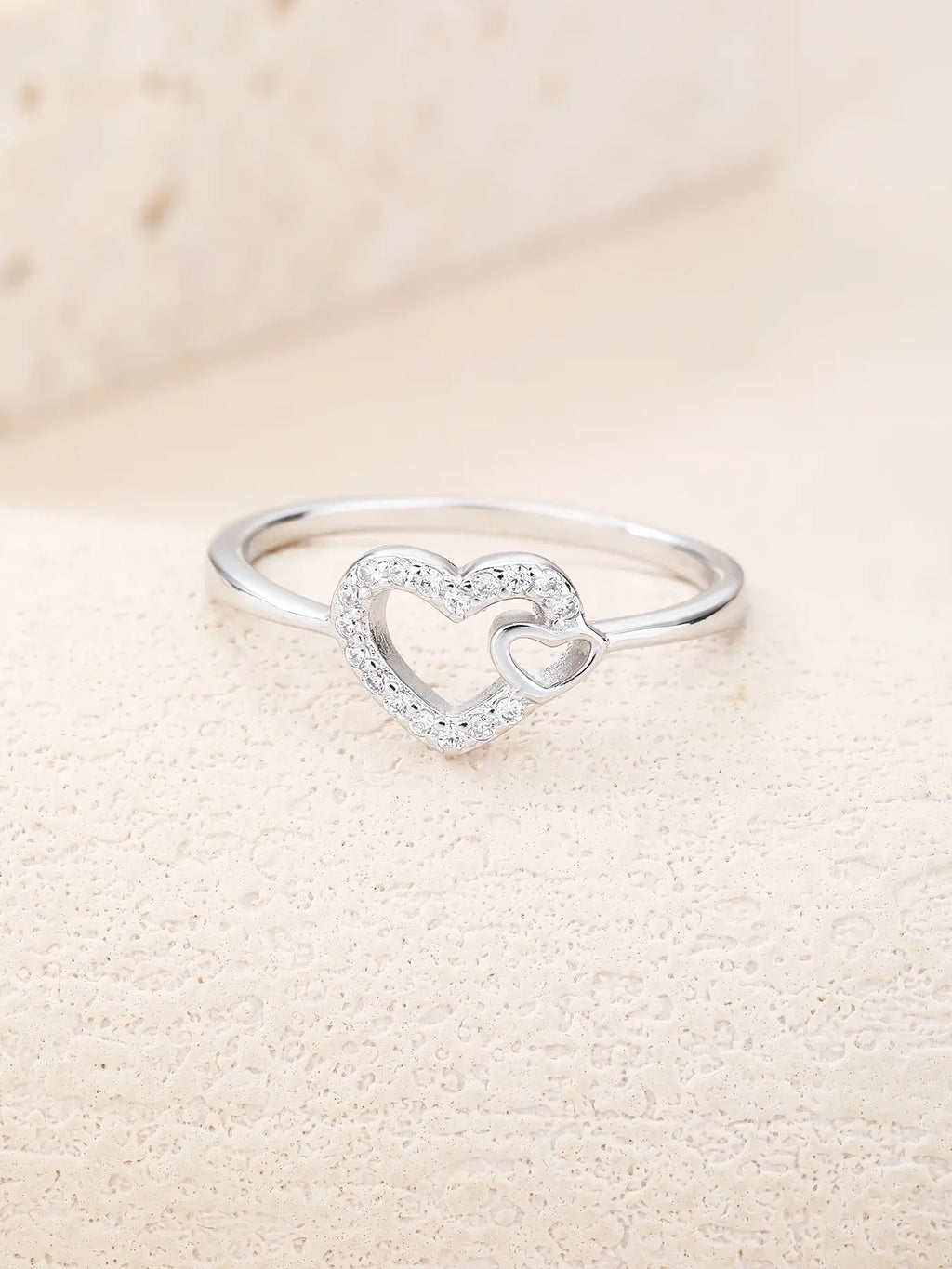 Silver ring with two hearts motif