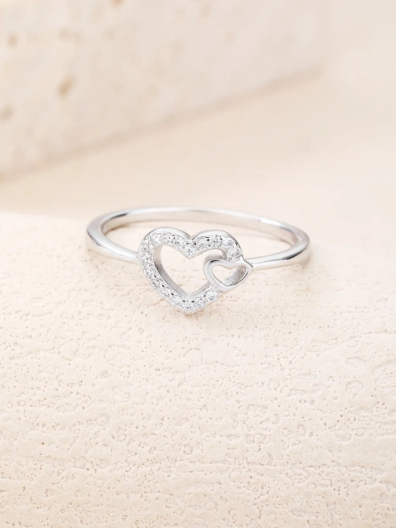 Silver ring with two hearts motif