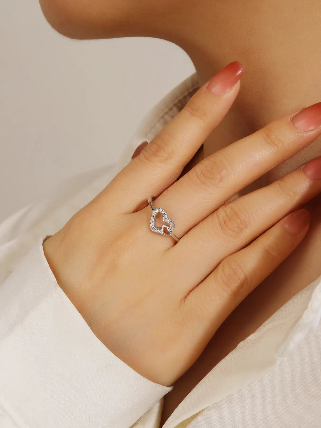 Silver ring with two hearts motif