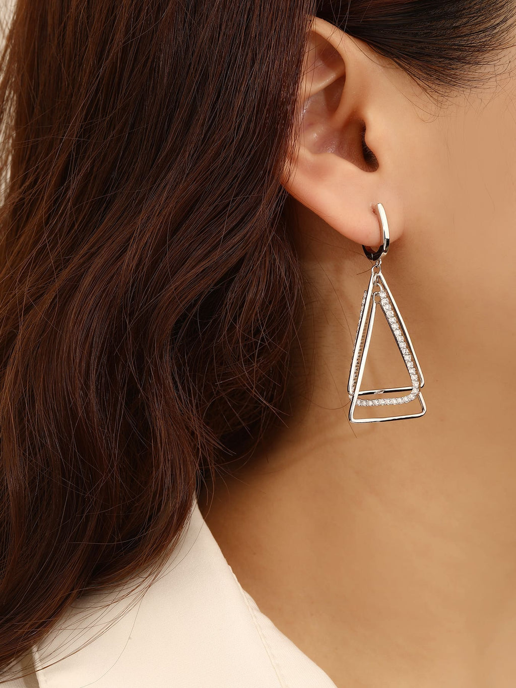 Open triangle white stone leverback earrings in hallmarked, rhodium-plated 925 sterling silver – worn view – DRESCHER Jewellery®