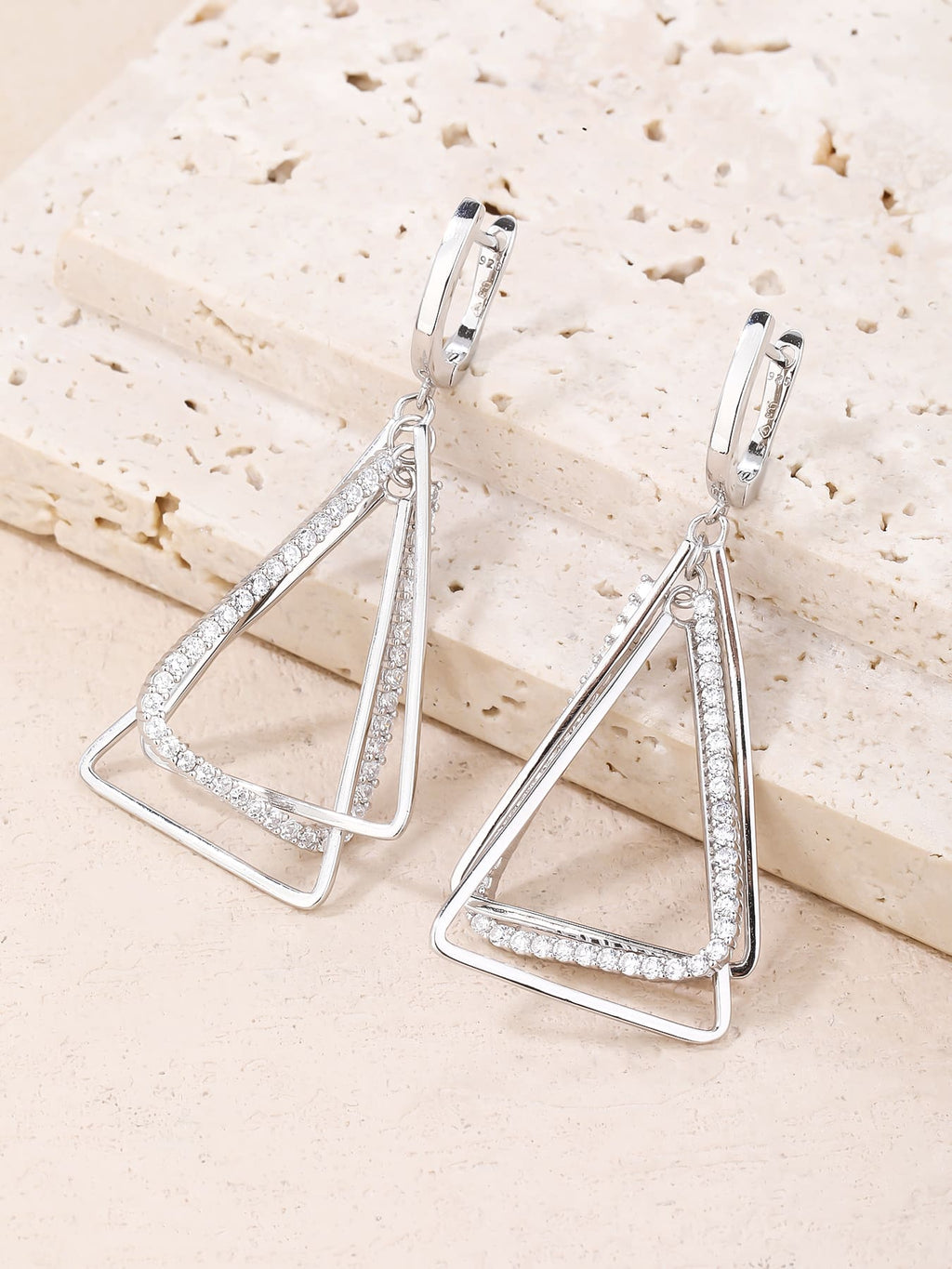 Open triangle white stone leverback earrings in hallmarked, rhodium-plated 925 sterling silver – display view – DRESCHER Jewellery®