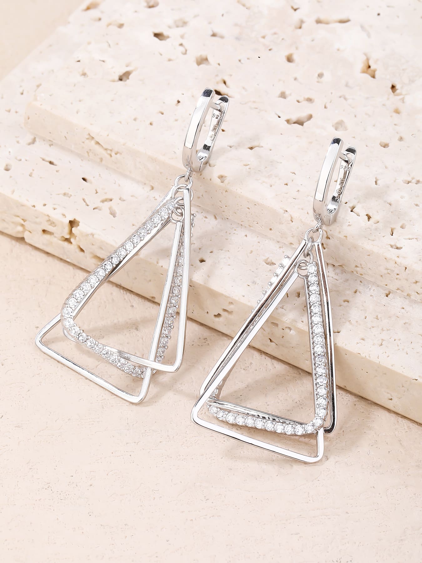 Open triangle white stone leverback earrings in hallmarked, rhodium-plated 925 sterling silver – display view – DRESCHER Jewellery®