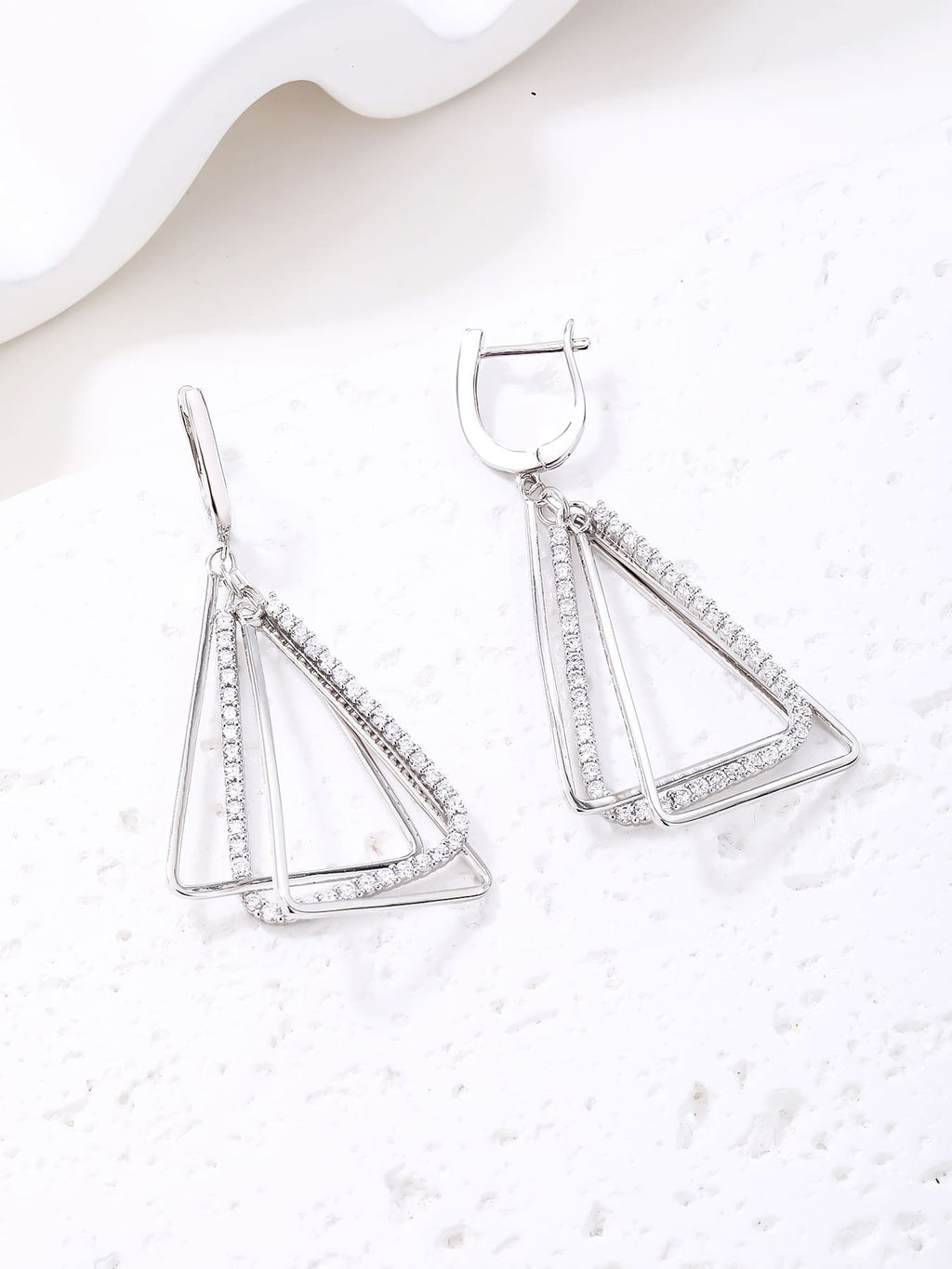 Open triangle white stone leverback earrings in hallmarked, rhodium-plated 925 sterling silver – display view – DRESCHER Jewellery®