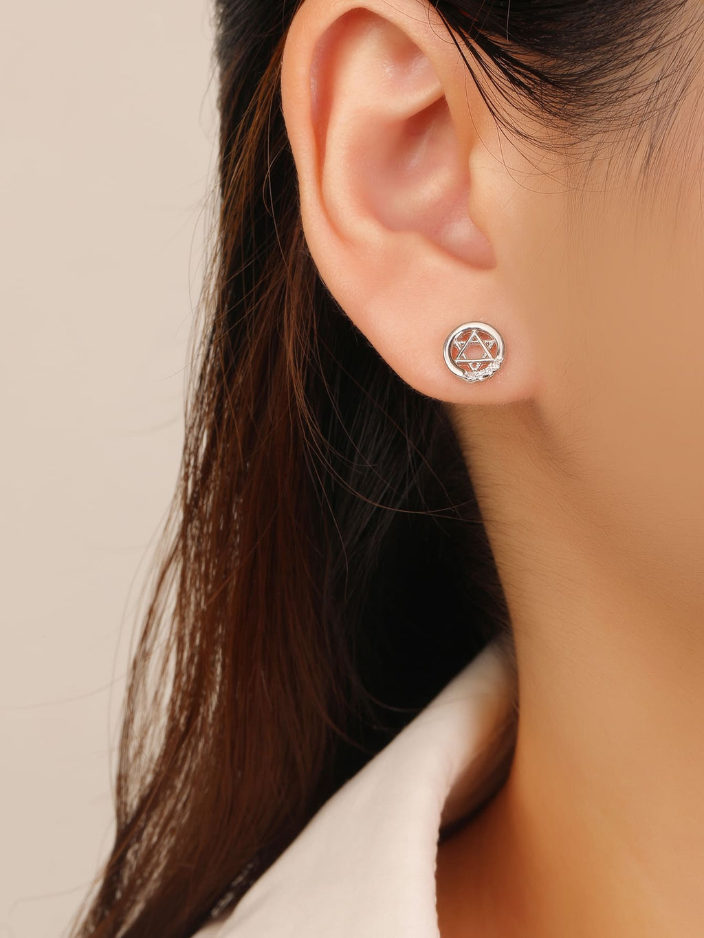 Six-pointed star white cubic zirconia stud earrings in hallmarked, rhodium-plated 925 sterling silver – worn view – DRESCHER Jewellery®
