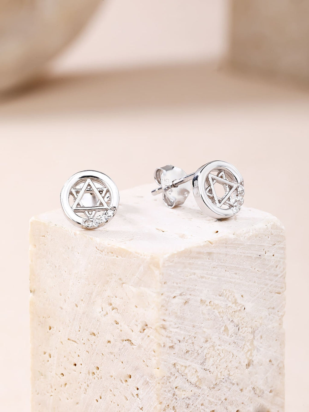 Six-pointed star white cubic zirconia stud earrings in hallmarked, rhodium-plated 925 sterling silver – display view – DRESCHER Jewellery®