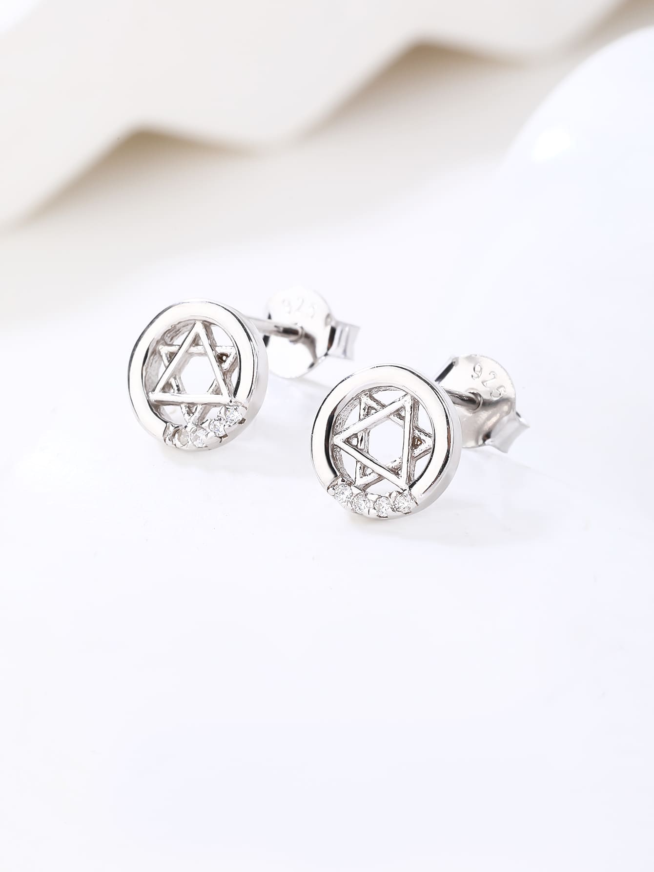 Six-pointed star white cubic zirconia stud earrings in hallmarked, rhodium-plated 925 sterling silver – display view – DRESCHER Jewellery®