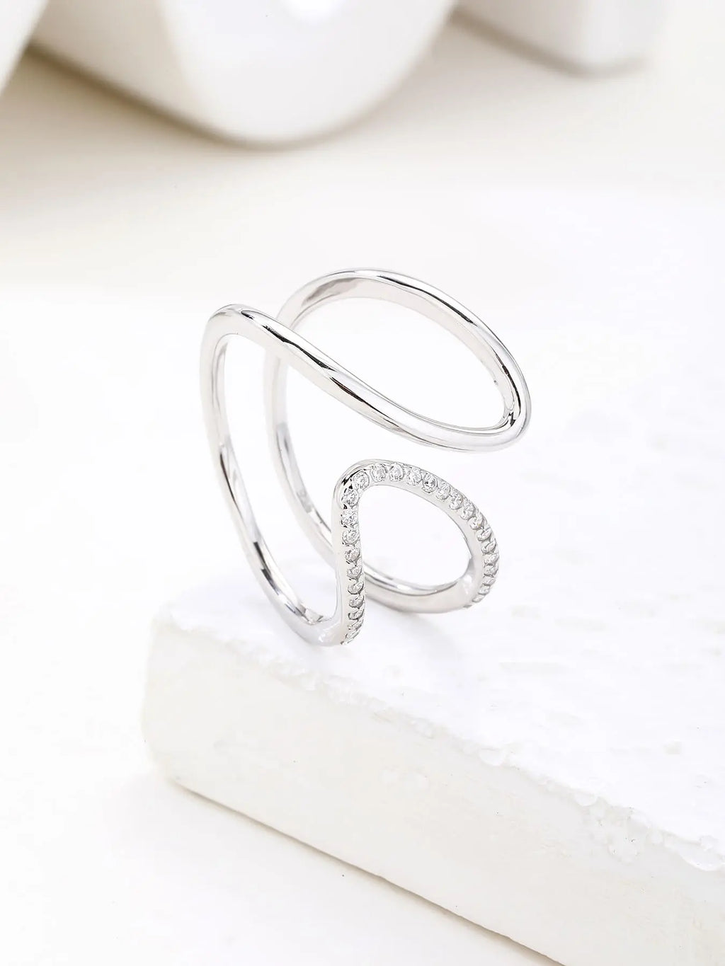 Silver wavy line ring with white cubic zirconia stones