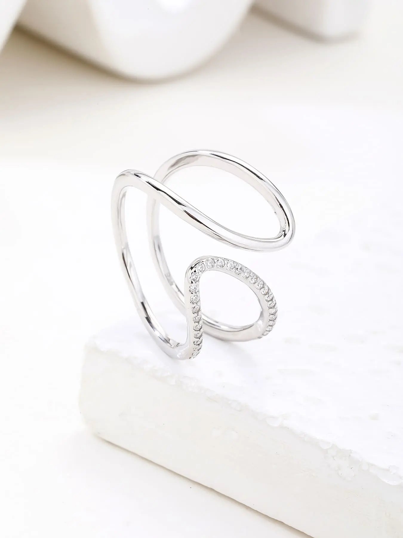 Silver wavy line ring with white cubic zirconia stones