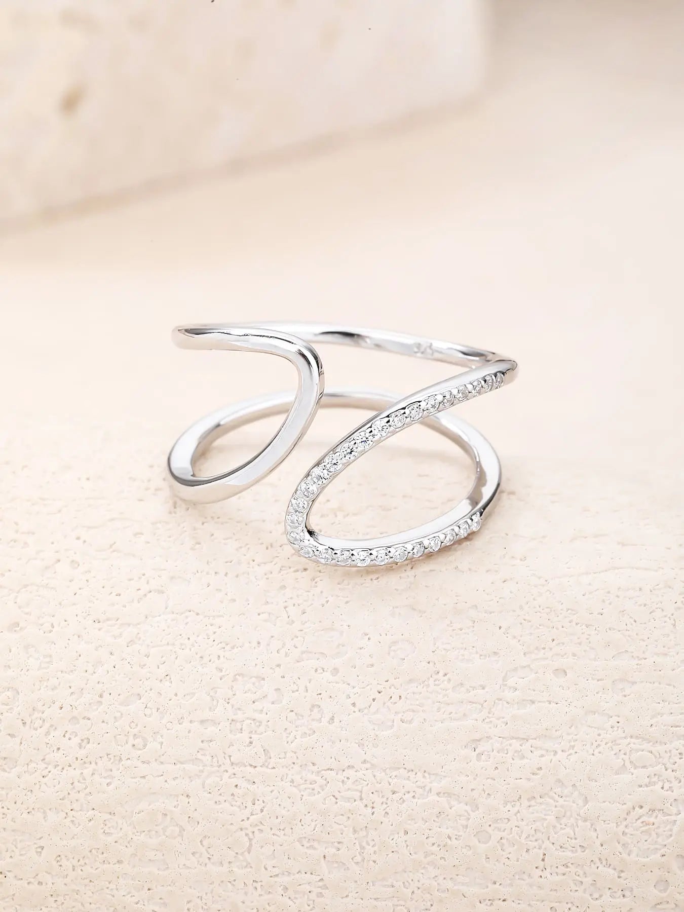 Silver wavy line ring with white cubic zirconia stones