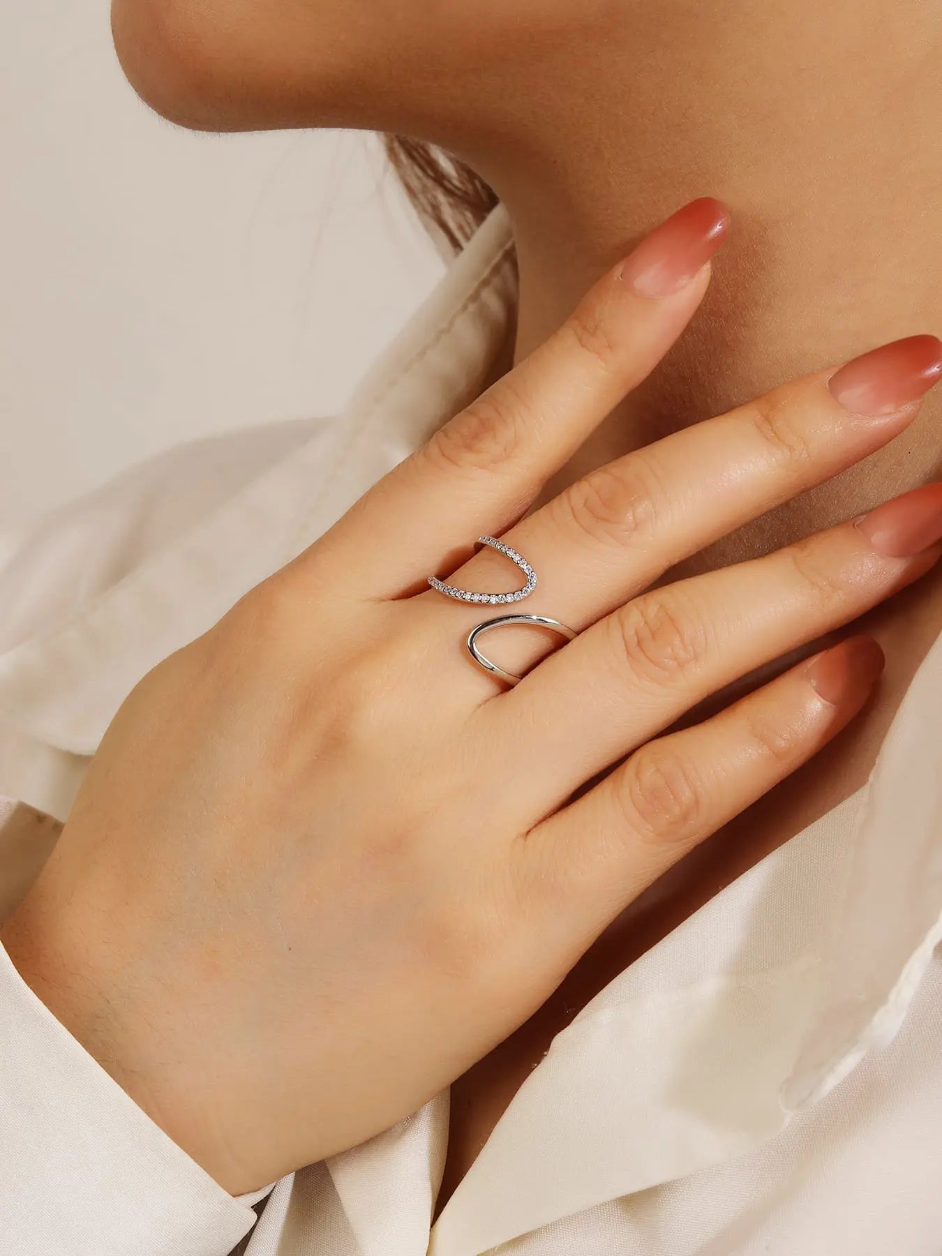 Silver wavy line ring with white cubic zirconia stones